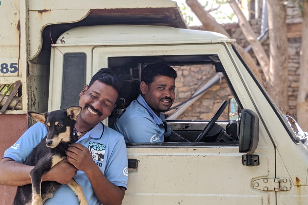 Team members Bunty and Kuldeep with vehicle and Betty the dog