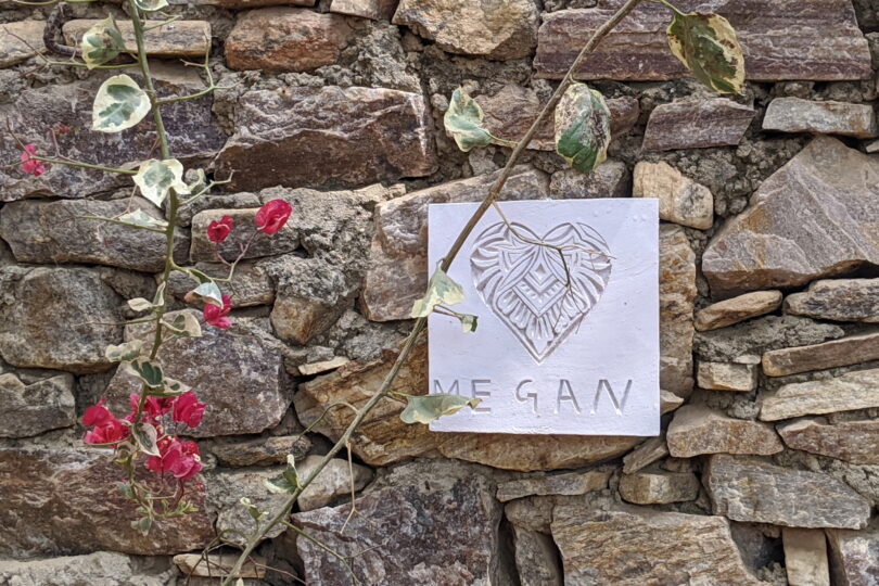 Pet Memorial plaque for Megan against a dry stone wall